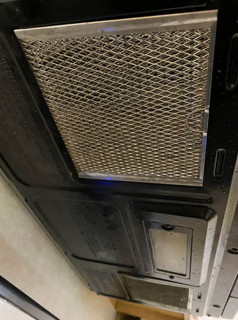 limpiar el filtro del extractor del microondas