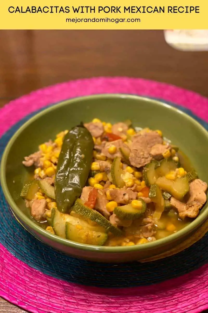 pork with zucchini or calabacitas in a green mexican plate